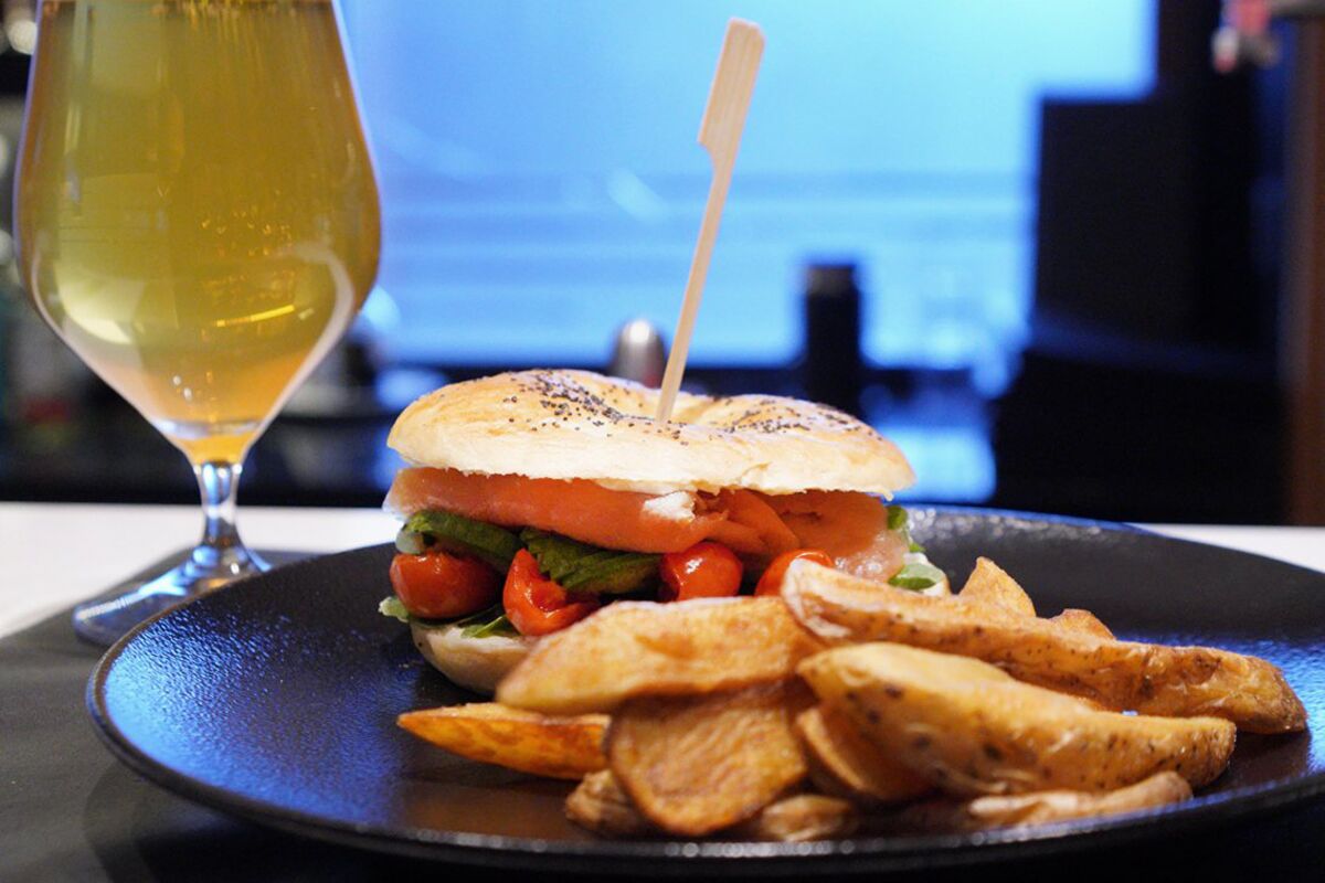 Burger with potato wedges and a glass of beer