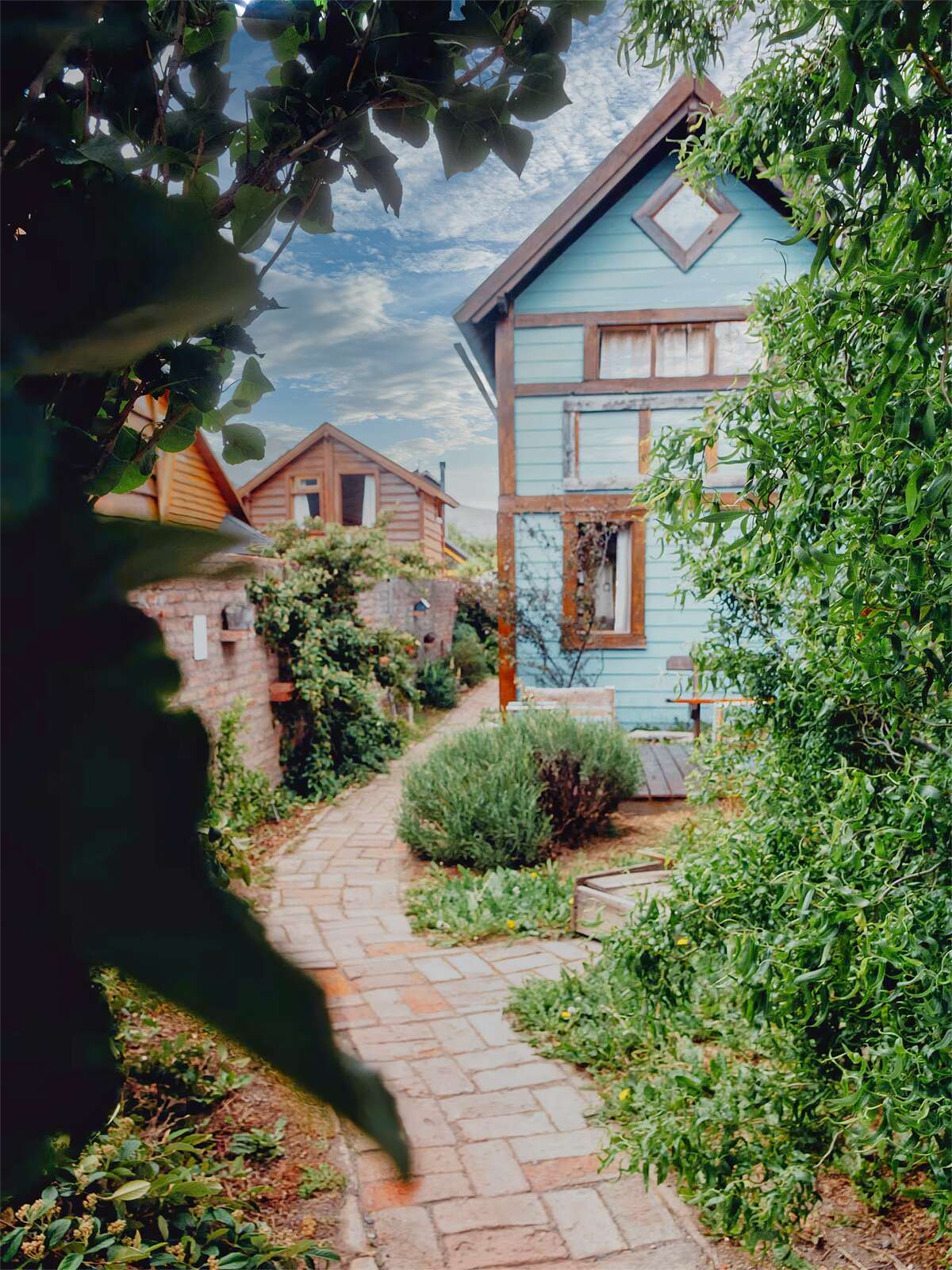 Brick path between the garden and the cabins