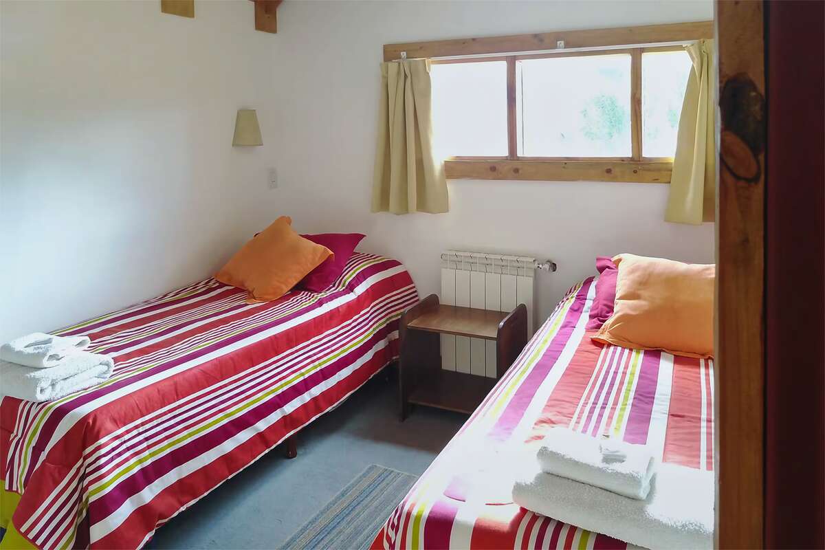 Bedroom with two single beds and a radiator